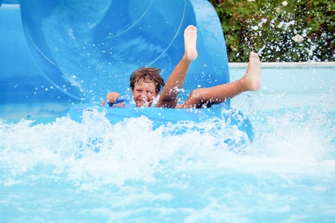 Boy-on-Waterslide-Tube.jpg