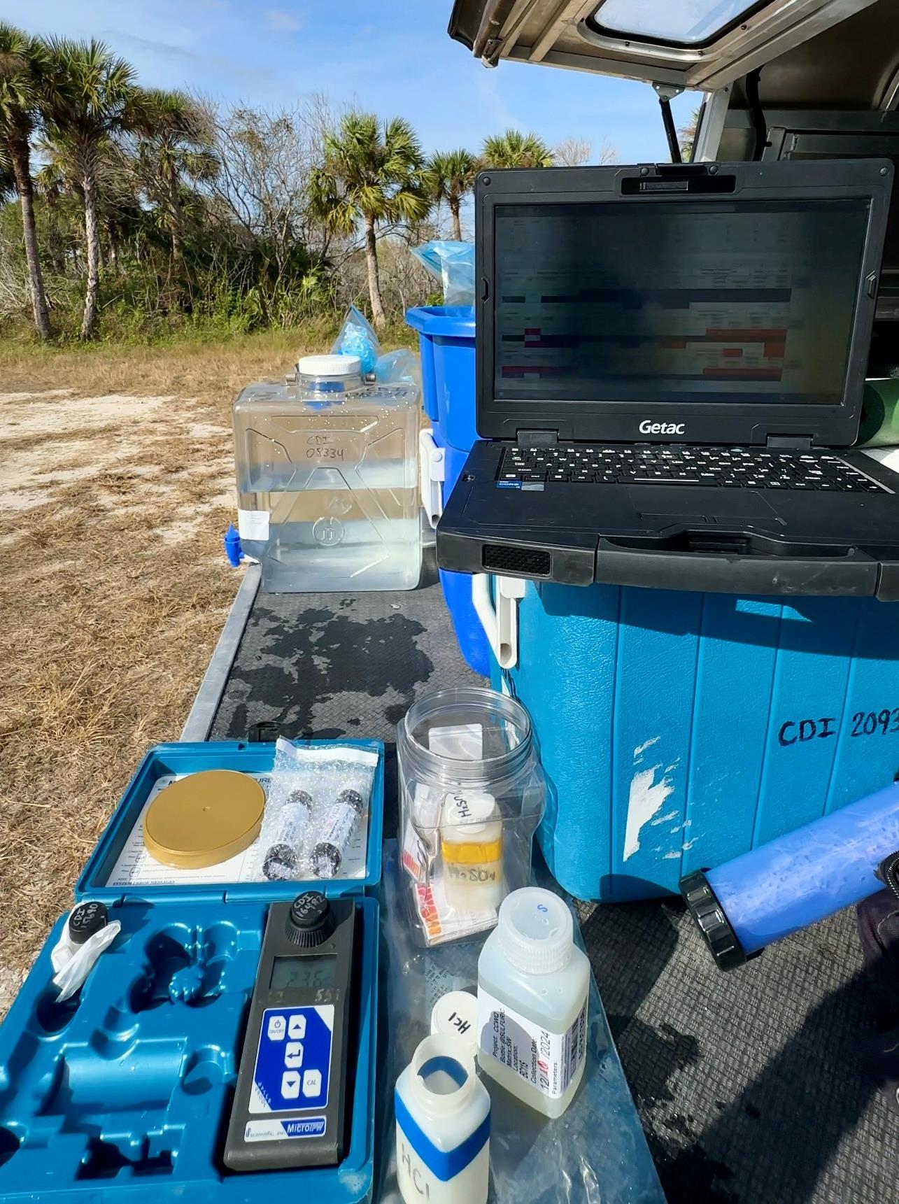 Water quality field sampling equipment and water samples.